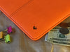 NueVue iPad case orange vegan leather with self cleaning interior
